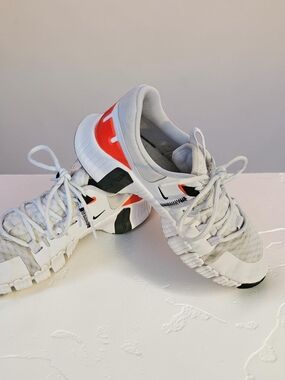Nike Free White Athletic Sneakers with Orange and Black Accents